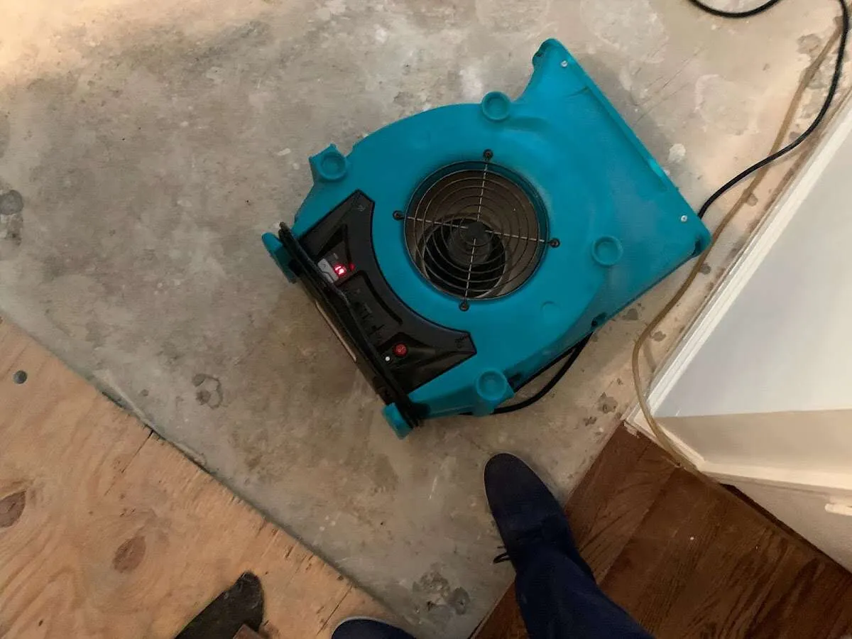Air mover drying subfloor during Commercial Water Damage Restoration in Scarborough